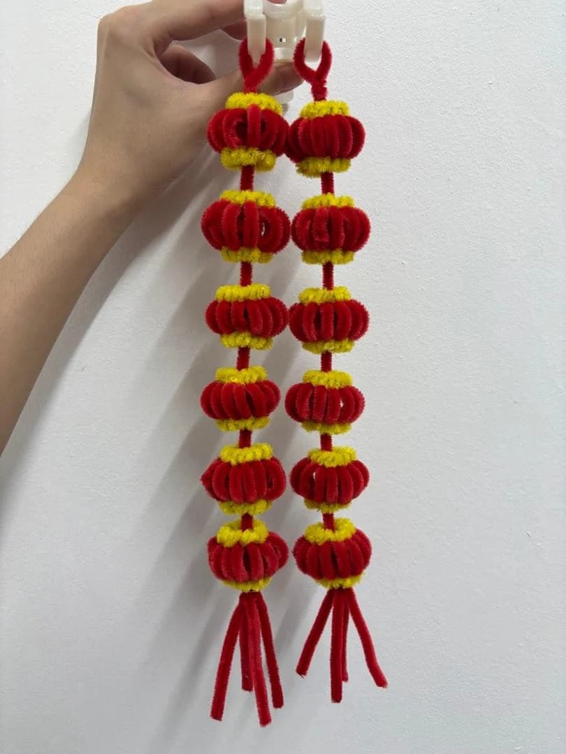 Red and yellow festive pipe-cleaner lantern garland