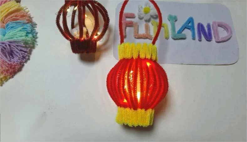 Illuminated red and yellow pipe-cleaner lantern craft