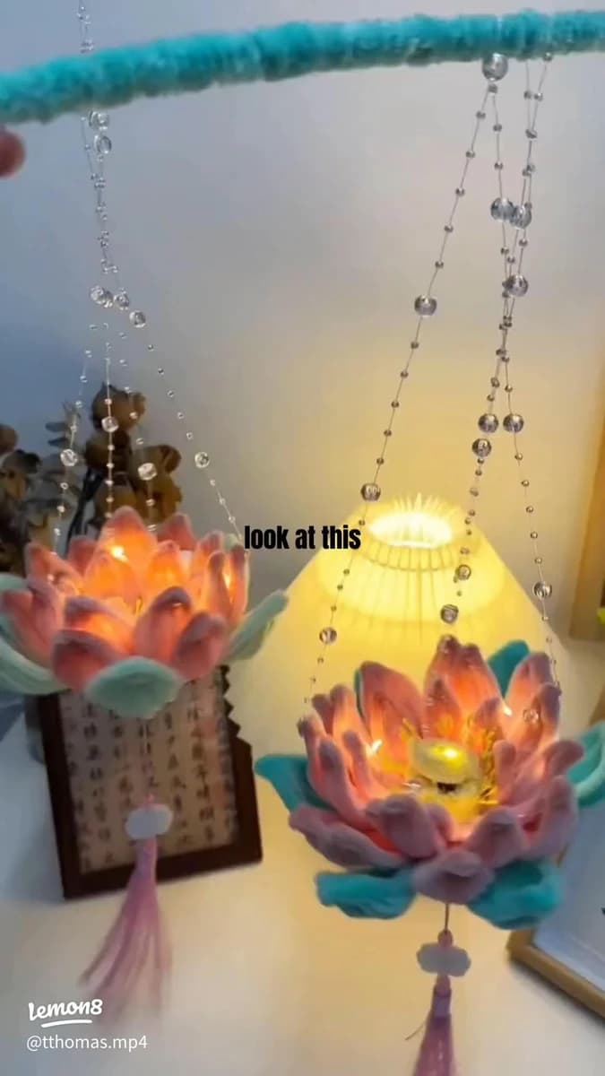 Decorative illuminated lotus flowers and bead hanging
