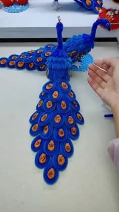Large blue pipe-cleaner peacock craft