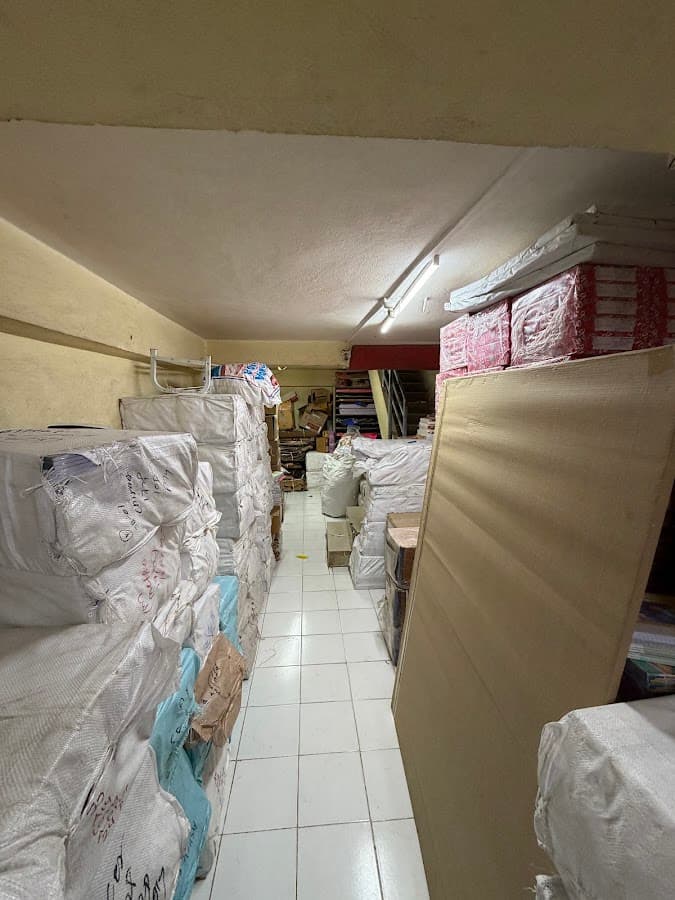 Bulk stock and packing area at Ashoka Stationers